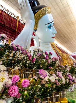 Big white Buddha image in reclining posture