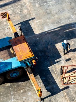 View from the top floor of the industrial plant directly above of truck crane