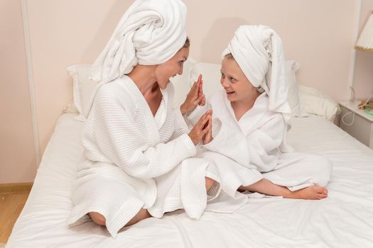 Daughter smiling dries bath love mom thinks elbows Creek bathrobe, concept white morning for lifestyle and hotel caucasian, little bathing. Hair funny comfort,