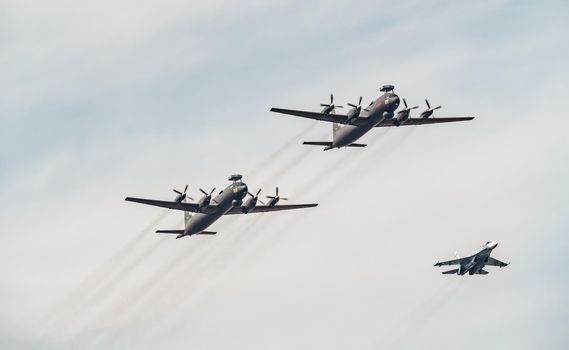 Russia, St. Petersburg, 28 July 2022: Military aircraft and helicopters of the air force fly on the city at the celebration of the Day of the Navy, amphibious and transport aircraft, anti-submarine. High quality photo