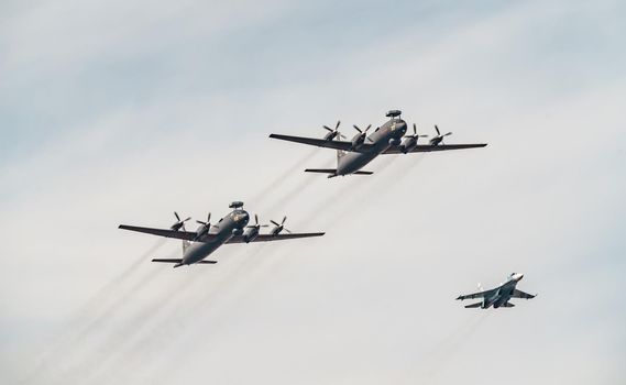 Russia, St. Petersburg, 28 July 2022: Military aircraft and helicopters of the air force fly on the city at the celebration of the Day of the Navy, amphibious and transport aircraft, anti-submarine. High quality photo