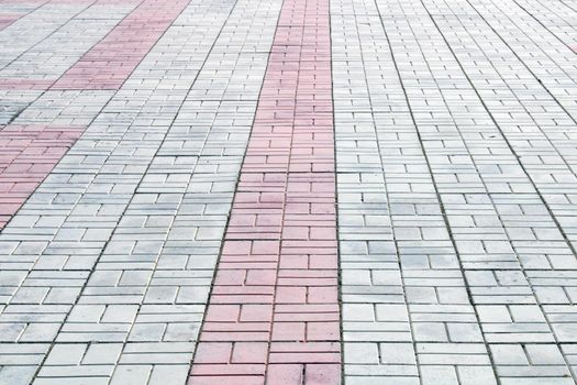 Sidewalk white, gray, red tiles. Architecture, construction. Abstract curly background..
