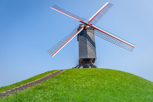 Rustic wooden windmills in Bruges public park, Belgium
