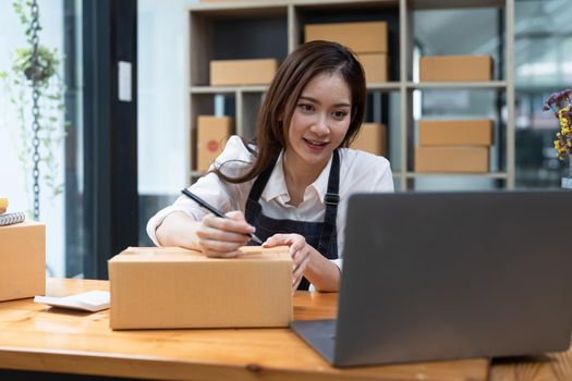 Small business a new start up in the present for online shop. By woman owner have a warehouse used to send to customer. SME entrepreneur concept.