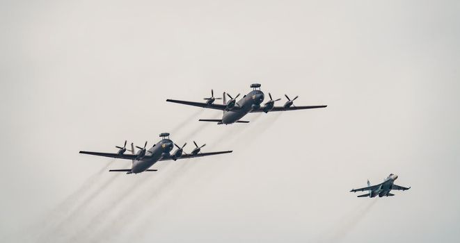 Russia, St. Petersburg, 28 July 2022: Military aircraft and helicopters of the air force fly on the city at the celebration of the Day of the Navy, amphibious and transport aircraft, anti-submarine. High quality photo