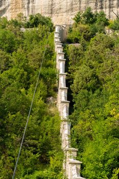 Ancient road city chufut bakhchisaray cave crimea medieval street monument, for sunny sky in architecture and travel chufut, mountain landmark. Town ruins moutain,