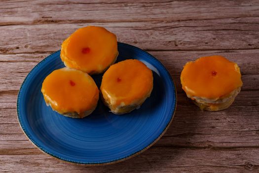 tortas locas, crazy cake typical from andalucia spain on a blue plate on a wooden background