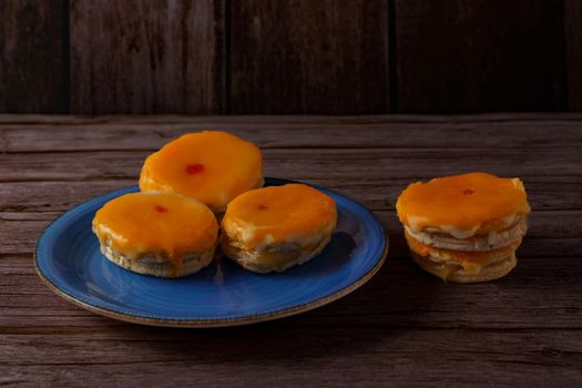 tortas locas, crazy cake typical from andalucia spain on a blue plate on a wooden background