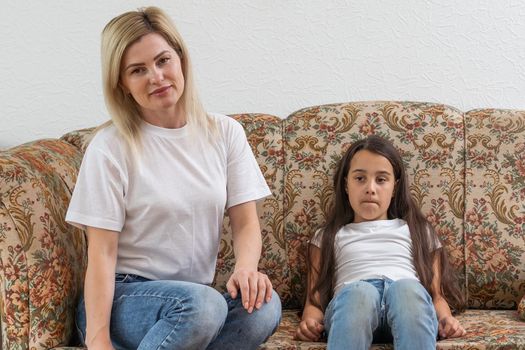 a mother scolds her young daughter.