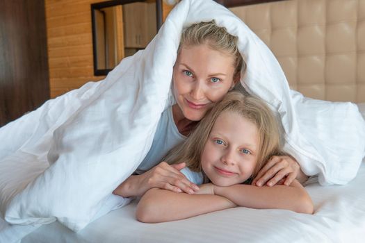 Blanket woman over family daughter glad bed head young eyes, concept sleeping white in caucasian and people smile, nap bedtime. Beauty relaxation serene,