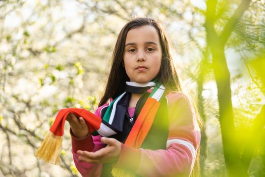 little girl with emirates flag, use it for Independence Day of Emirates on December 2.