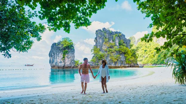 Koh Hong Island Krabi Thailand, a couple of men and women on the beach of Koh Hong, a tropical white beach with Asian women and European men in Krabi Thailand