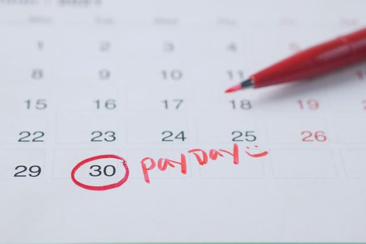 payday concept with marking on a calendar date