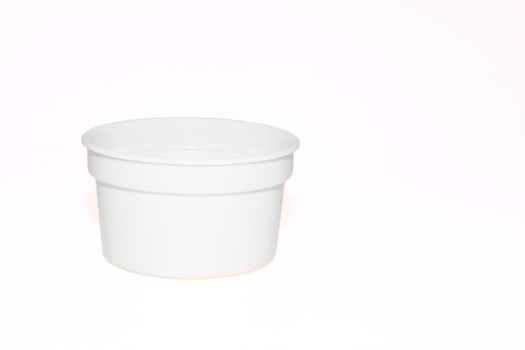 a wide mouthed cylindrical container made of glass or pottery and typically having a lid, used especially for storing product. White plastic jar capacity of isolated on white