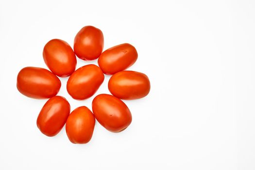 a glossy red, or occasionally yellow, pulpy edible fruit that is eaten as a vegetable or in salad. Juicy ripe tomatoes isolated on the white background, space for notes .