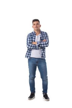 Full length portrait of young man standing with arms crossed isolated over white background