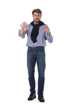 Full length portrait of young business man in casual clothes doing stop gesture isolated on white background
