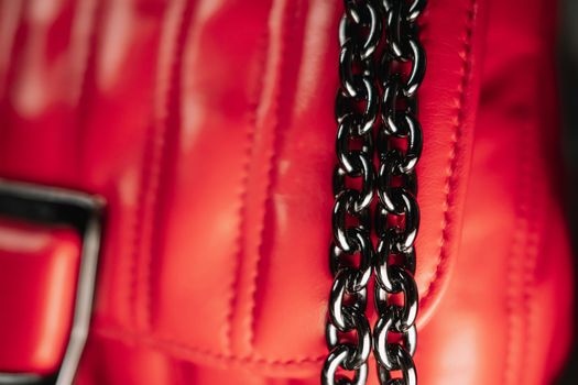 Beautiful red leather bag with gun metal black chain handle. Fashion accessories, trendy quilted bag. High quality photo