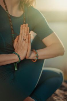 Woman practicing yoga, namaste gratitude mudra alone on high mountain above river at summertime. Religion, purity, resignation, spirituality concept. High quality photo