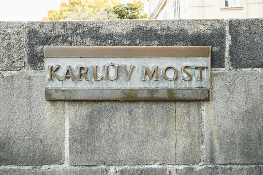 Brass name sign of Karluv Most - Charles bridge in Prague, Czech Republic. High quality photo