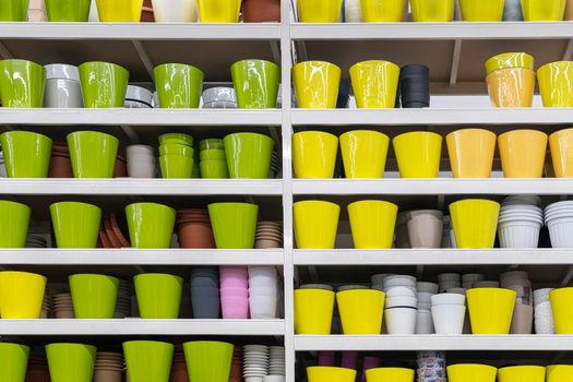 colorful flower pots on the shelves of the store . for the entire frame. High quality photo