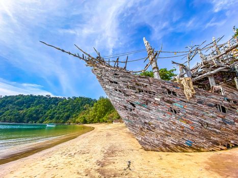 Old wooden pirate boat on the beach in Koh Phayam, Ranong, Thailand, south east asia