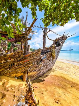 Old wooden pirate boat on the beach in Koh Phayam, Ranong, Thailand, south east asia