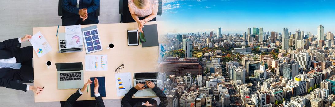 Business people group meeting shot from top widen view in office . Profession businesswomen, businessmen and office workers working in team conference with project planning document on meeting table .