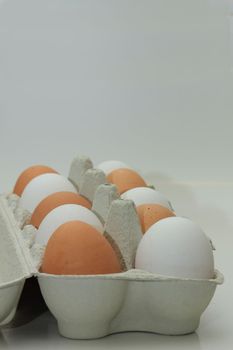 Ten fresh eggs in a carton box