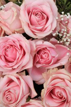 Big pink roses in a floral wedding decoration