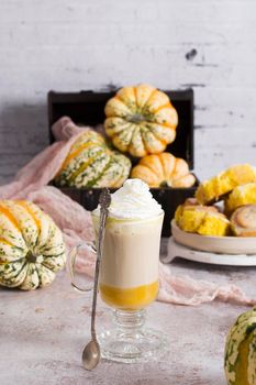 pumpkin cinnabons and latte for dessert, holiday table with pastries, home sweet home, autumn menu. High quality photo