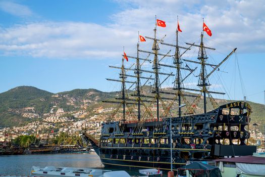 Turkey, Alanya - November 9, 2020: Walking ship stand in port of Alanya. Bay of ships.