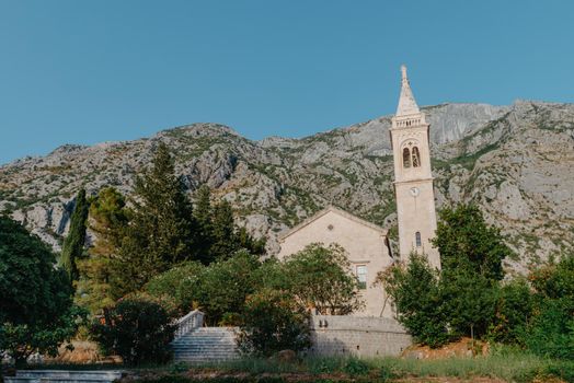Beautiful view of the coast of Kotor Bay and St.Eustace's Church in the village Dobrota in Montenegro. Church of St. Eustachius is located in Dobrota , Kotor Montenegro