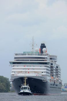 Velsen, The Netherlands - June 7th 2017: Queen Victoria, Cunard on North Sea Channel in heavy weather towards IJmuiden sea lock and North Sea