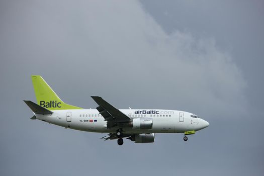 Amsterdam the Netherlands - July 20th 2017: YL-BBM Air Baltic Boeing 737-500 approaching Schiphol Amsterdam Airport Polderbaan runway