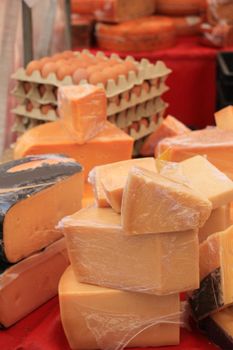 Traditional Dutch cheeses on display on a market stall