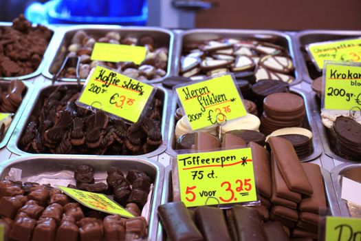 Chocolates on display on a confectioner's market stall (tags: prices and product information in Dutch)