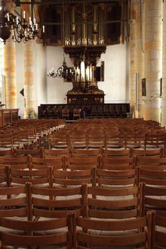 Simple wooden chairs in a Dutch Reformed Church