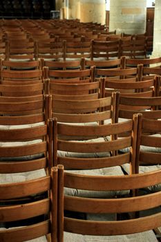 Simple wooden chairs in a Dutch Reformed Church