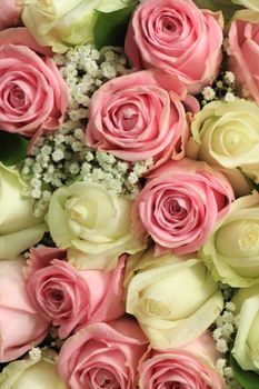 Pink and white  roses in a floral wedding decoration