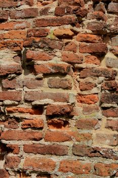 Vintage red bricks in an old brick wall