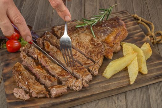 Veal cutlet from Avila, Spain with potatoes and vegetables juicy and tender