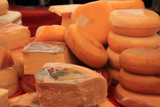 Traditional Dutch cheeses on display on a market stall