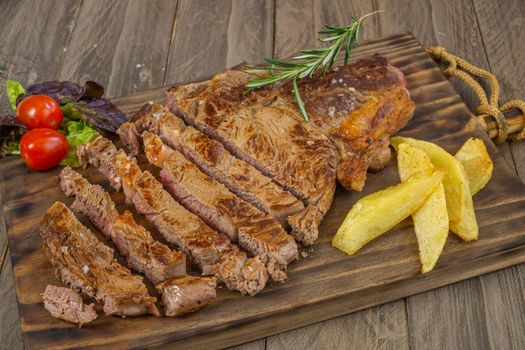 Veal cutlet from Avila, Spain with potatoes and vegetables juicy and tender