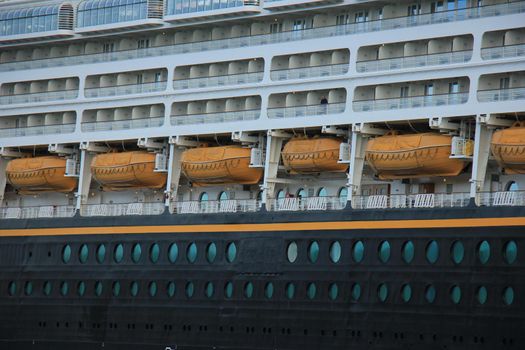 Velsen, the Netherlands - June, 27th 2017: Disney Magic on North Sea Canal, detail of cabins and lifeboats