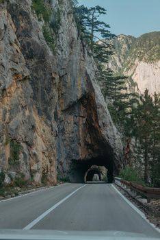 Empty route and small tunnel in mountain.