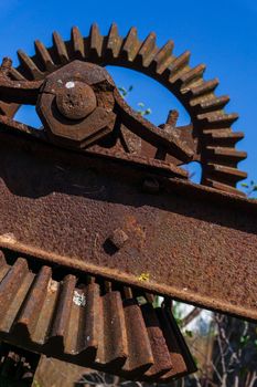 Old rusty gears details of the mechanism of an old abandoned mill close up