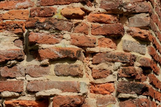 Vintage red bricks in an old brick wall