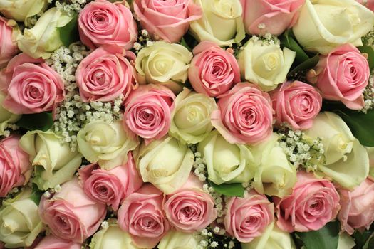 Pink and white  roses in a floral wedding decoration