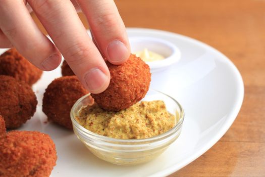 Bitterballen with mustard, warm fried snack, served in the Netherlands